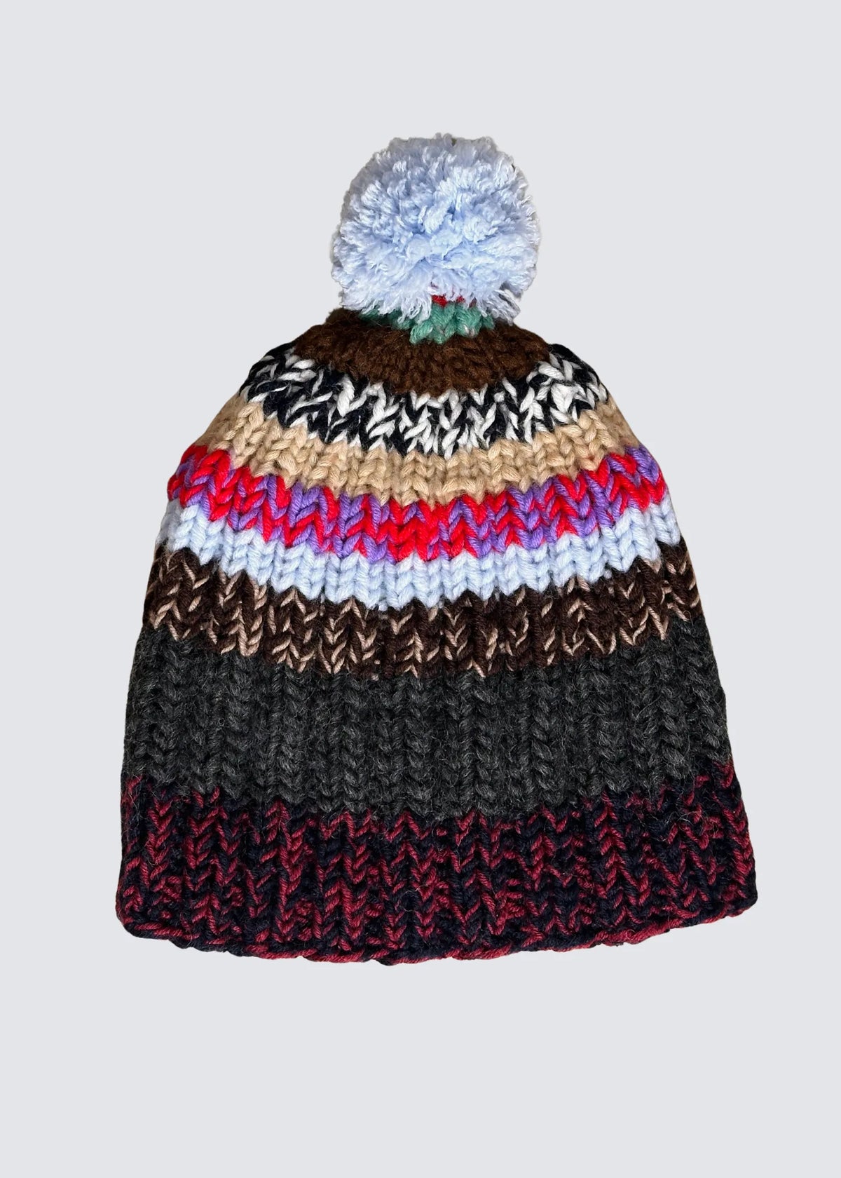 Balcon Pressing Strickmütze, mehrfarbig mit Bommel, freistehend abgelichtet.