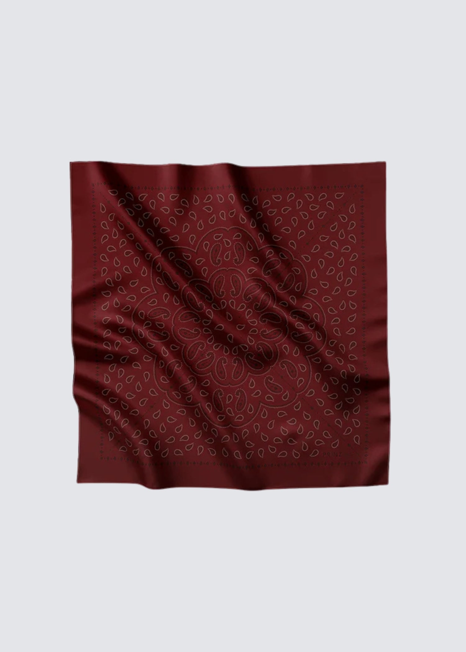 Prinz Berlin bordeaux Paisley mit Musterung, man sieht weiße Ornamente auf bordeaux Farbenden Grund. Flatshot. 